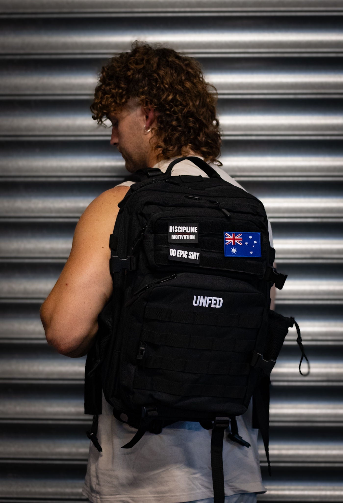 UnFed Club 45L Stealth Black backpack side profile - structured shape